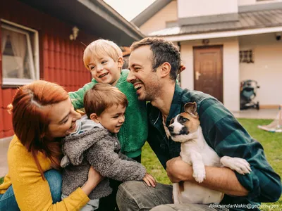 Excited family welcoming a new puppy